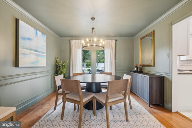 520 Perry Dr, Mount Laurel, NJ 08054 - dining space with a chandelier, light wood-style floors, crown molding, and wainscoting