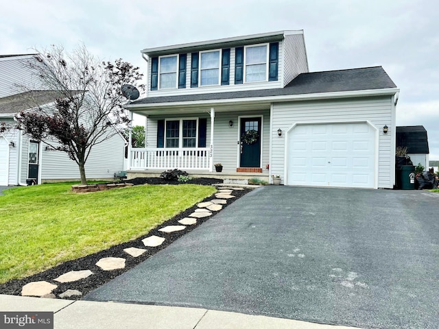 323 Swatara Creek Dr, Jonestown, PA 17038 - traditional-style house featuring a porch, a garage, driveway, and a front yard