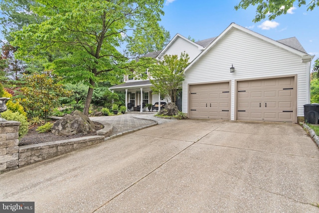 602 Tallowood Ln, Mount Laurel, NJ 08054 - traditional-style home featuring concrete driveway, an attached garage, and a porch