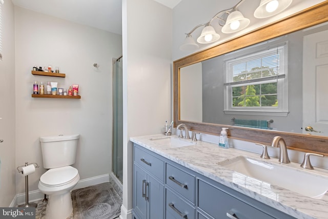 602 Tallowood Ln, Mount Laurel, NJ 08054 - bathroom featuring toilet, baseboards, double vanity, and a stall shower
