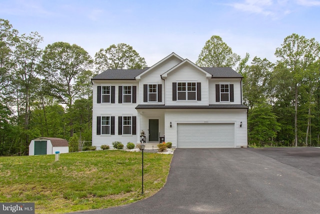11041 Lee St, King George, VA 22485 - view of front of property with an attached garage, driveway, and a front lawn