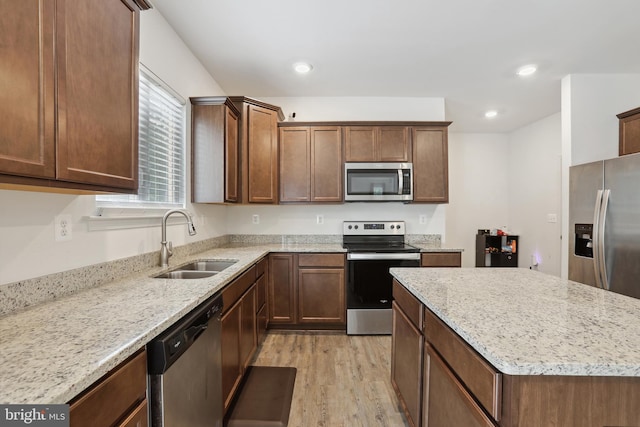 11041 Lee St, King George, VA 22485 - kitchen with stainless steel appliances, a sink, light wood-type flooring, light stone countertops, and recessed lighting