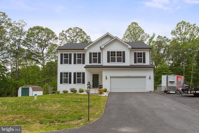 11041 Lee St, King George, VA 22485 - view of front of property featuring an attached garage, asphalt driveway, and a front yard