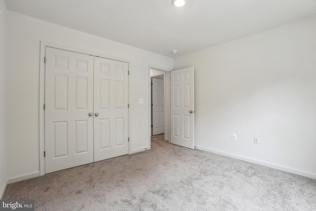 11041 Lee St, King George, VA 22485 - unfurnished bedroom with carpet flooring, baseboards, and a closet