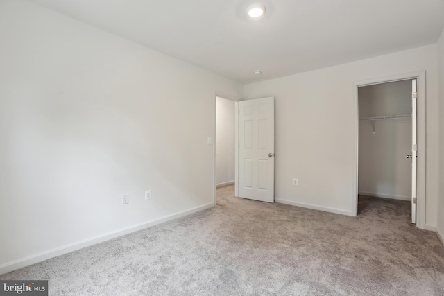 11041 Lee St, King George, VA 22485 - unfurnished bedroom featuring carpet, baseboards, a spacious closet, and a closet