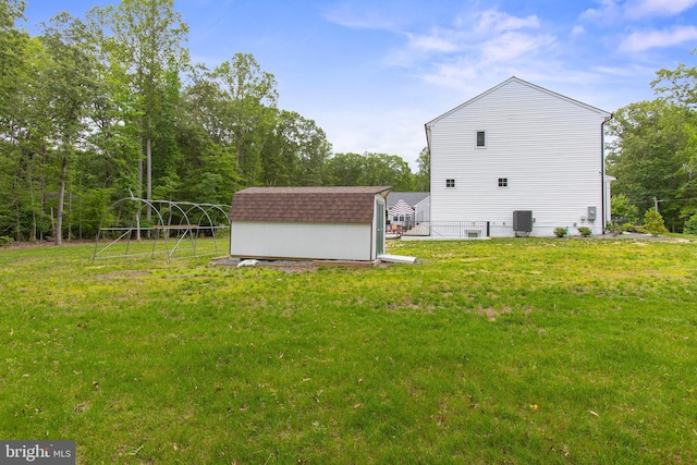 11041 Lee St, King George, VA 22485 - view of home's exterior featuring a yard and central AC