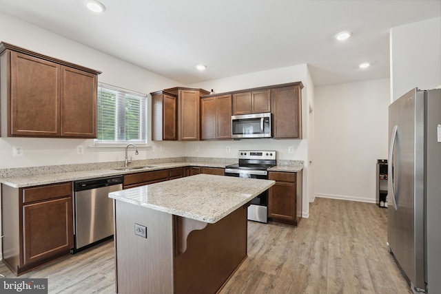 11041 Lee St, King George, VA 22485 - kitchen featuring stainless steel appliances, a sink, light wood-style floors, a center island, and recessed lighting