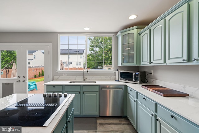 9235 Stephanie St, Manassas Park, VA 20111 - kitchen featuring appliances with stainless steel finishes, a sink, green cabinetry, dark wood-style floors, and recessed lighting