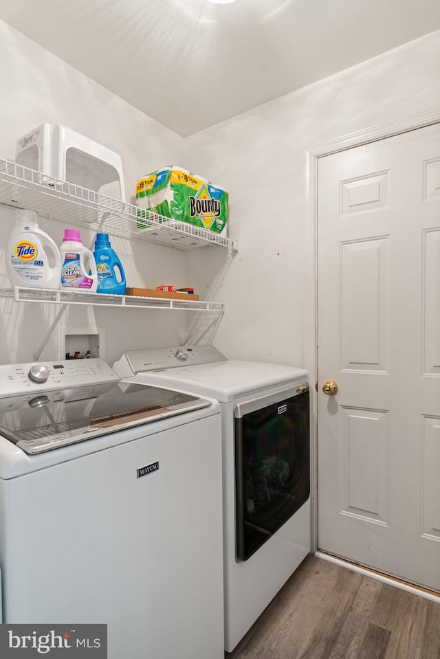 9235 Stephanie St, Manassas Park, VA 20111 - laundry area featuring washing machine and clothes dryer and wood finished floors