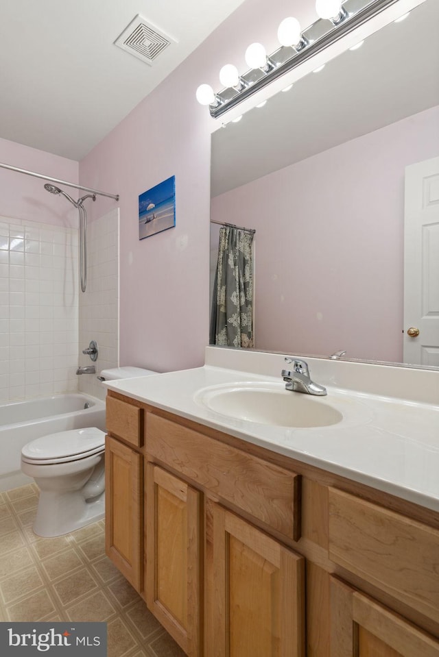 9235 Stephanie St, Manassas Park, VA 20111 - bathroom with vanity, toilet, shower / tub combo, and tile patterned floors