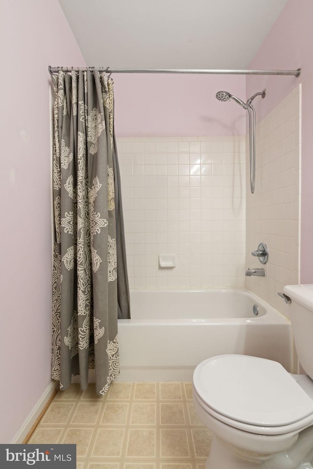 9235 Stephanie St, Manassas Park, VA 20111 - bathroom featuring shower / bath combo with shower curtain and toilet