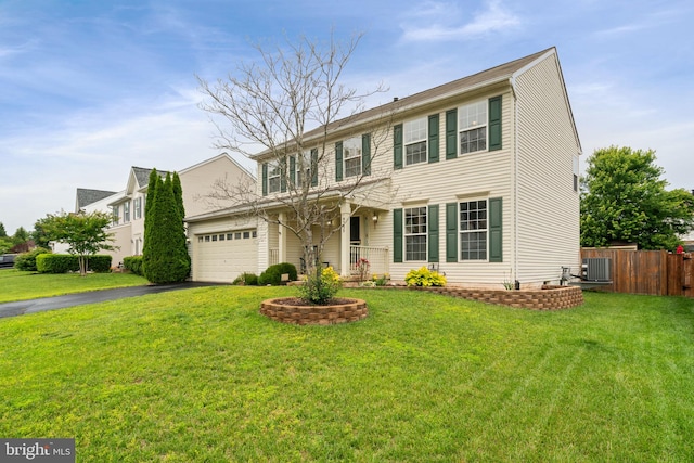 9235 Stephanie St, Manassas Park, VA 20111 - view of front of home with asphalt driveway, central AC unit, and an attached garage