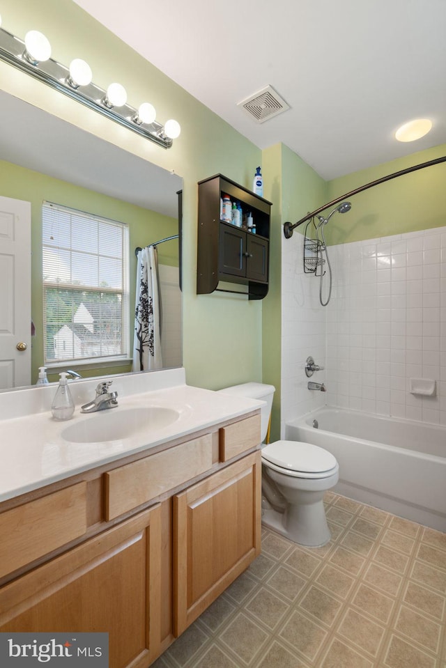 9235 Stephanie St, Manassas Park, VA 20111 - bathroom with vanity, shower / tub combo with curtain, tile patterned floors, and toilet