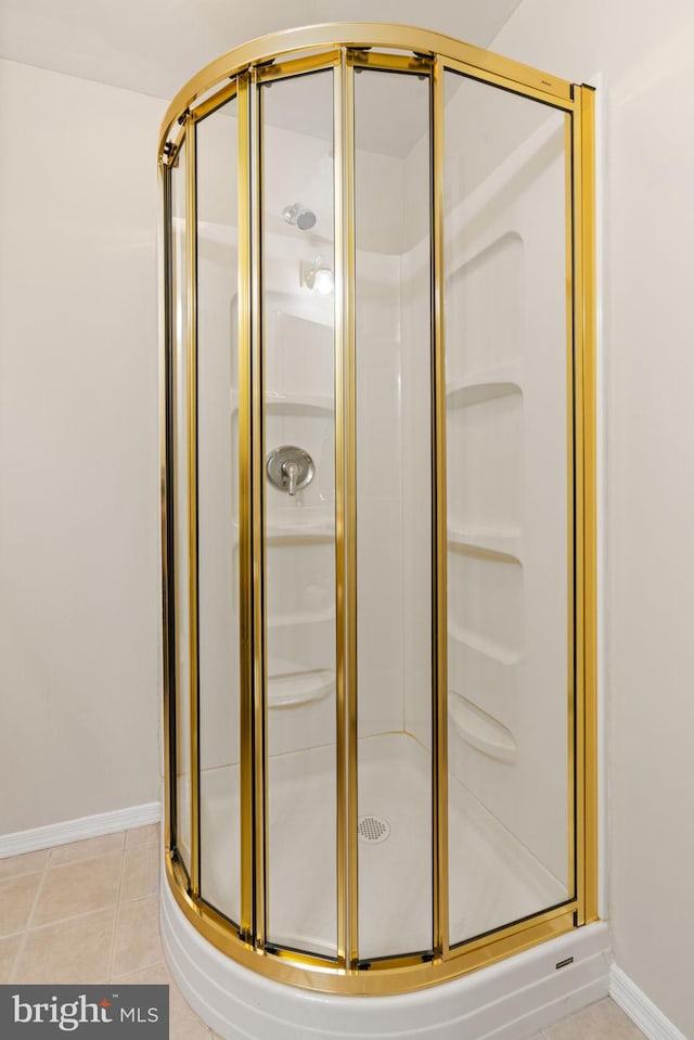 9235 Stephanie St, Manassas Park, VA 20111 - bathroom featuring a shower stall, baseboards, and tile patterned floors