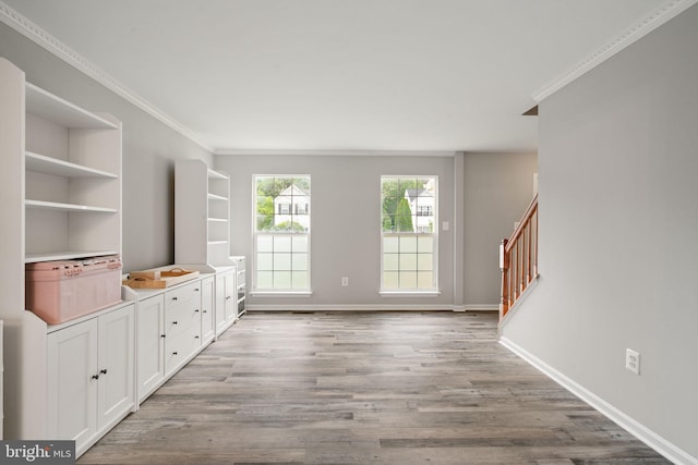 9235 Stephanie St, Manassas Park, VA 20111 - unfurnished living room featuring light wood-style flooring, crown molding, baseboards, and stairway