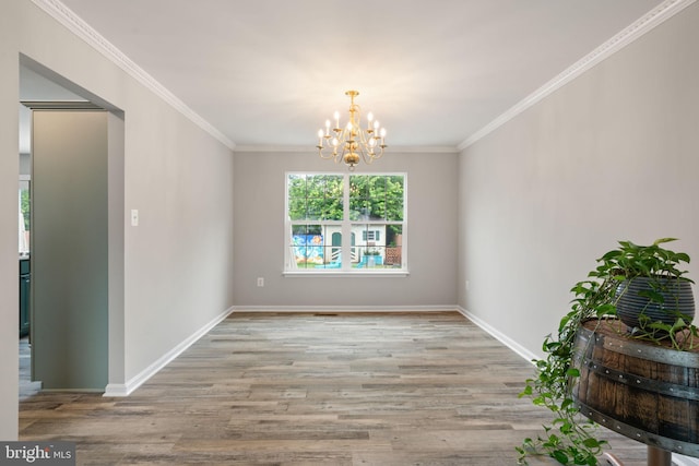 9235 Stephanie St, Manassas Park, VA 20111 - unfurnished dining area featuring a chandelier, wood finished floors, ornamental molding, and baseboards