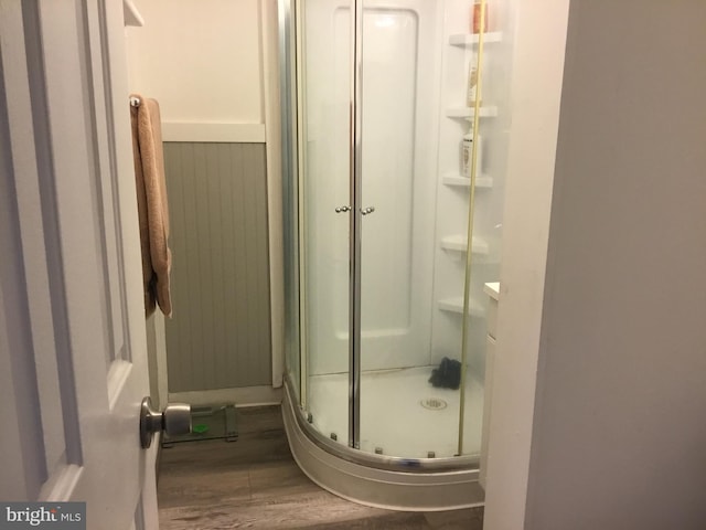 7709 Gromwell Ct, Springfield, VA 22152 - full bath featuring a stall shower and wood finished floors