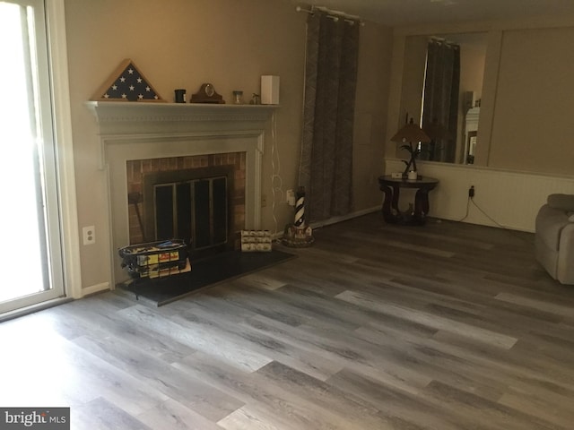 7709 Gromwell Ct, Springfield, VA 22152 - living area with wood finished floors and a brick fireplace
