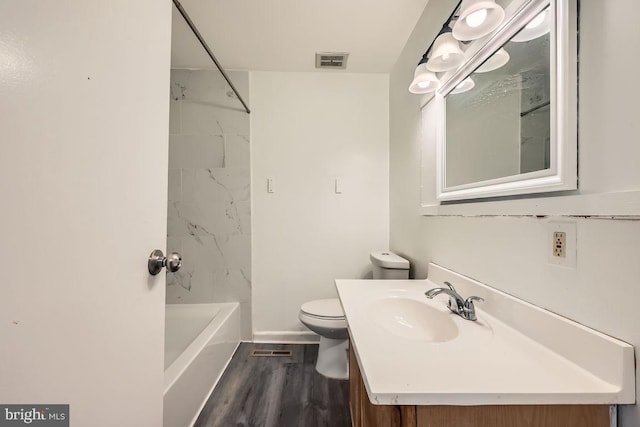 1571 Charlestown Dr, Edgewood, MD 21040 - full bathroom featuring toilet, vanity, wood finished floors, baseboards, and bathtub / shower combination