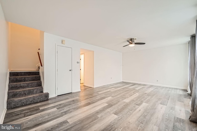 1571 Charlestown Dr, Edgewood, MD 21040 - unfurnished living room with a ceiling fan, wood finished floors, stairway, and baseboards