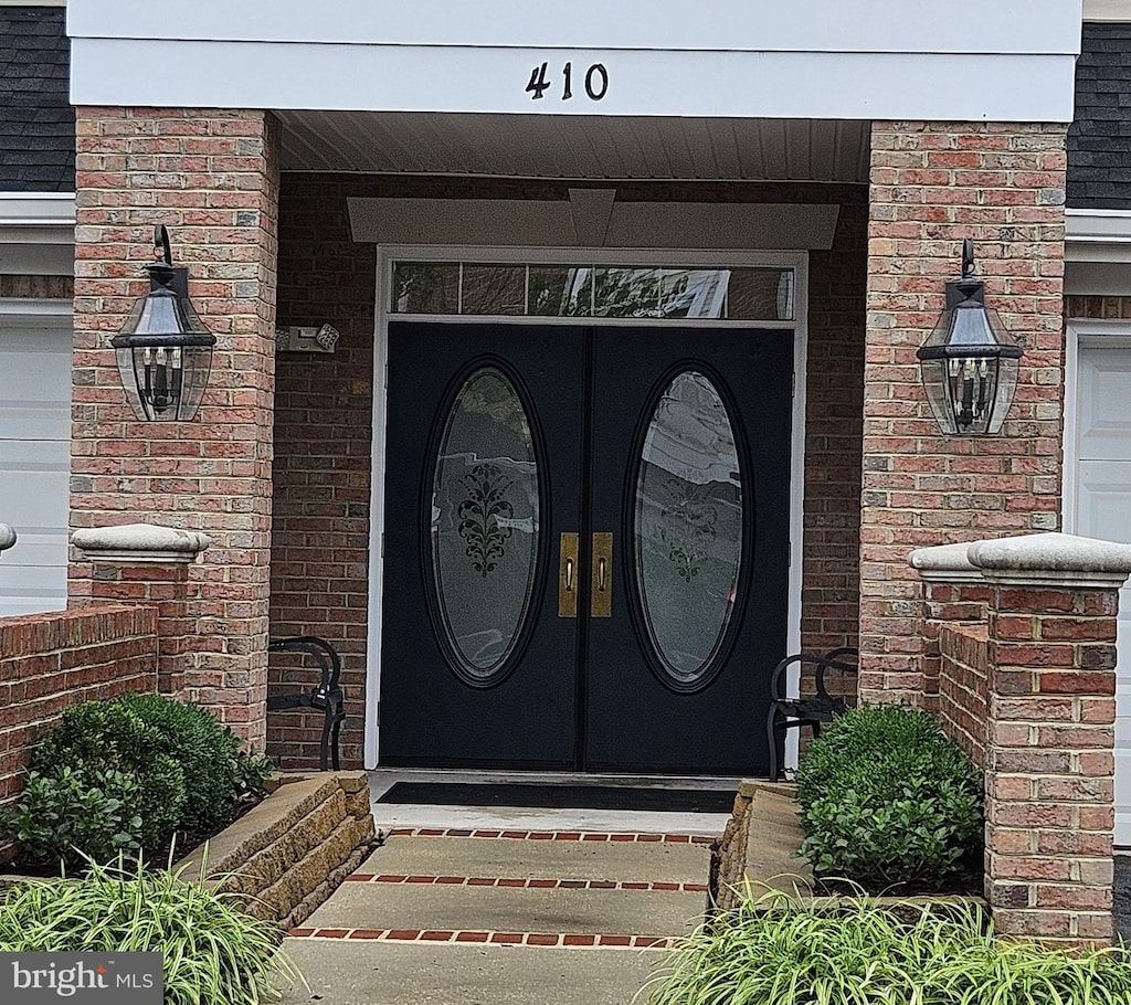 410 Hamlet Club Dr Unit 203, Edgewater, MD 21037 - view of exterior entry featuring french doors and brick siding