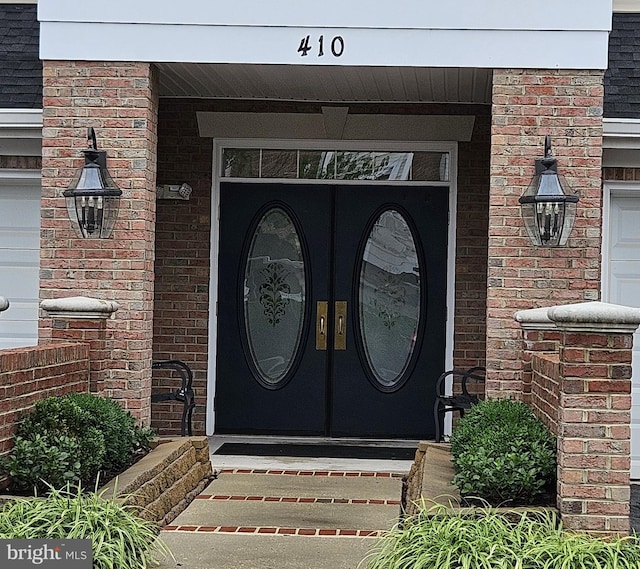410 Hamlet Club Dr Unit 203, Edgewater, MD 21037 - view of exterior entry featuring french doors and brick siding