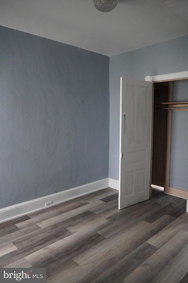 1506 Centre Ave, Reading, PA 19601 - unfurnished bedroom with wood finished floors, baseboards, and a closet