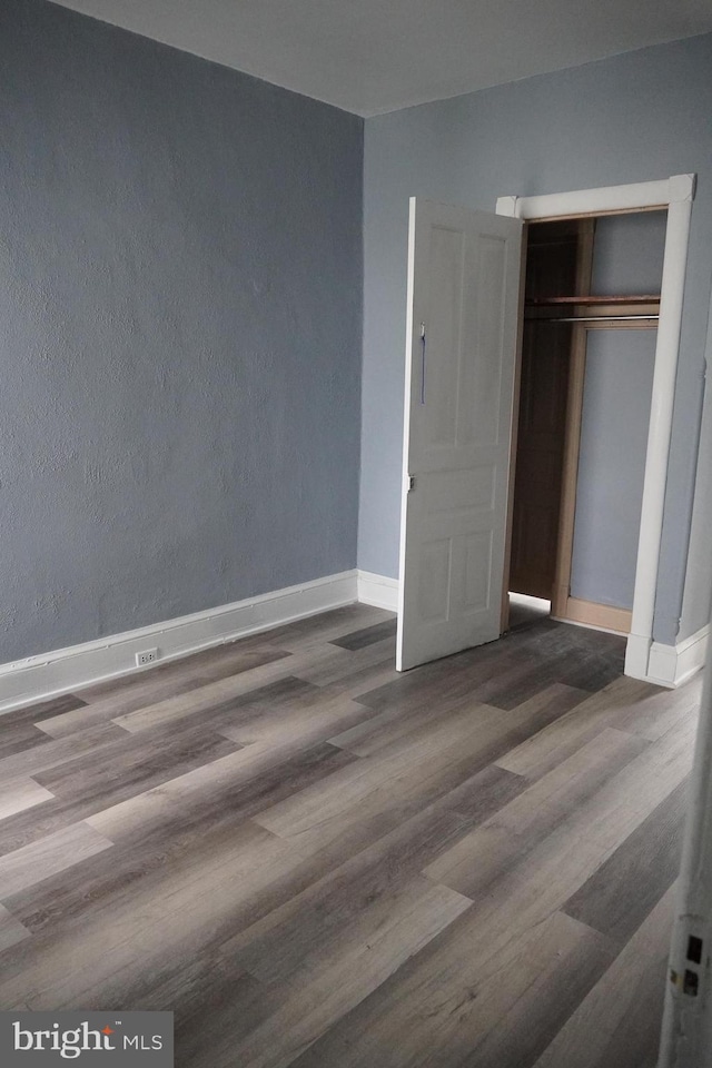 1506 Centre Ave, Reading, PA 19601 - unfurnished bedroom featuring wood finished floors, baseboards, and a closet