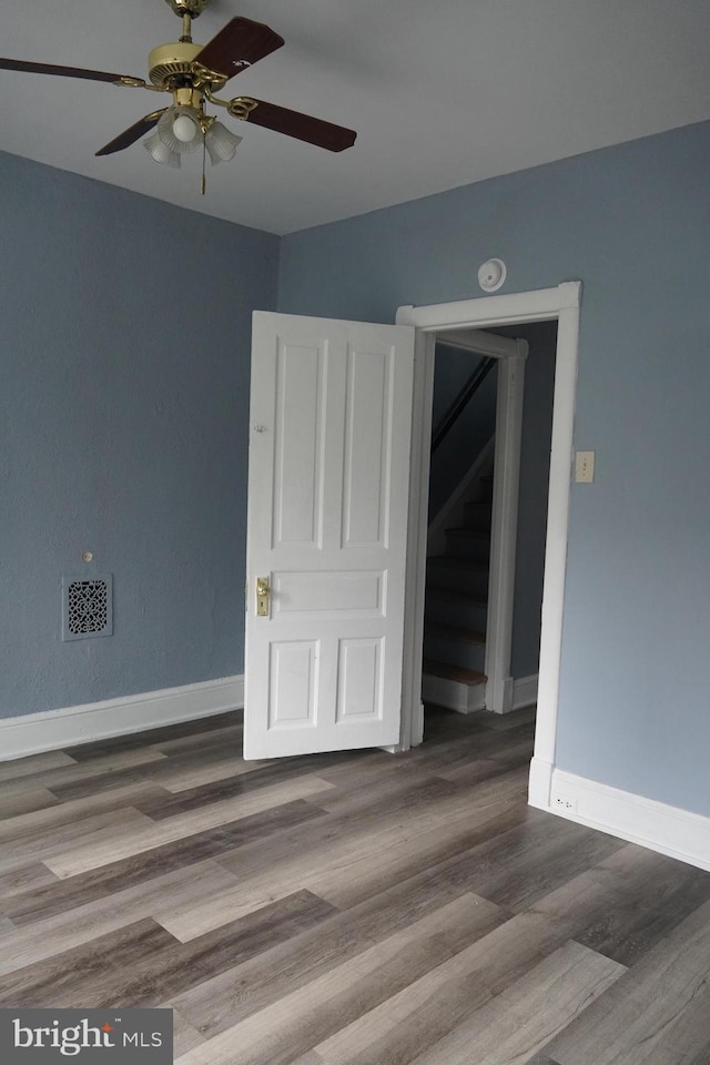 1506 Centre Ave, Reading, PA 19601 - empty room featuring ceiling fan, baseboards, wood finished floors, and a smoke detector