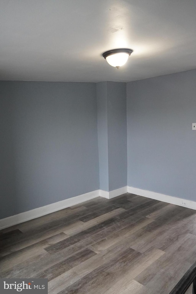1506 Centre Ave, Reading, PA 19601 - unfurnished room with dark wood-type flooring and baseboards