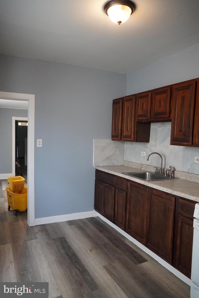 1506 Centre Ave, Reading, PA 19601 - kitchen with a sink, light countertops, dark wood-style floors, and baseboards