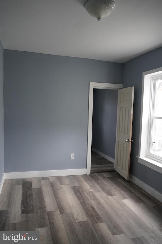 1506 Centre Ave, Reading, PA 19601 - unfurnished bedroom with wood finished floors and baseboards