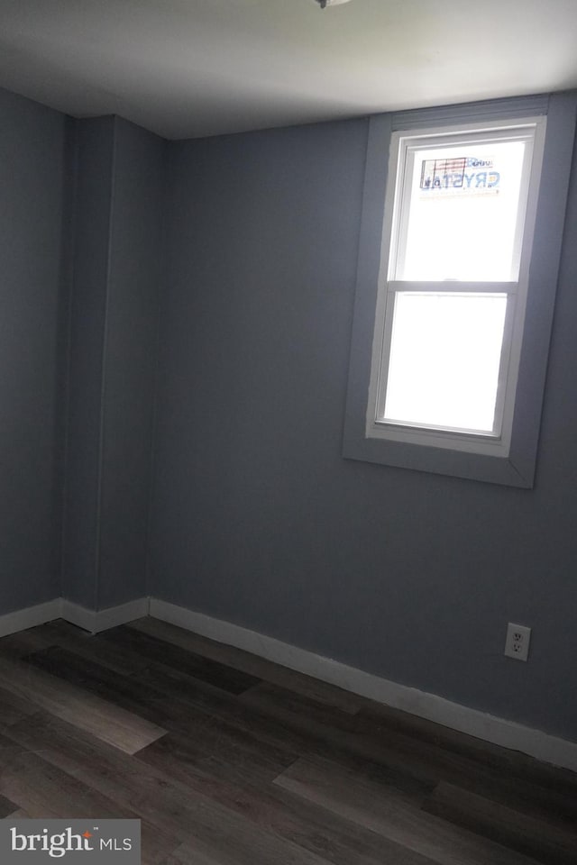 1506 Centre Ave, Reading, PA 19601 - spare room featuring baseboards and dark wood-style floors