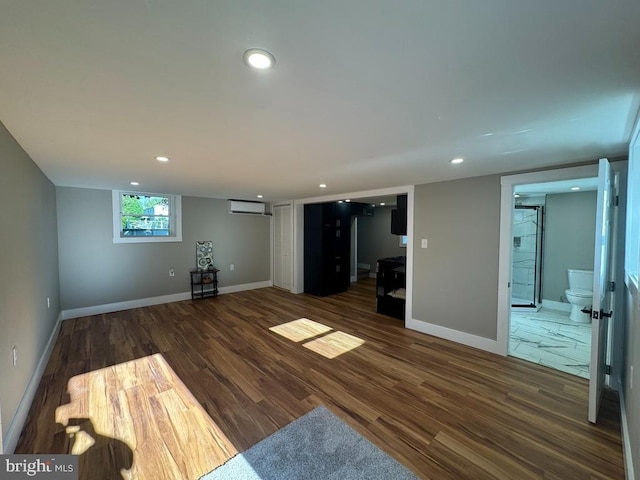 10 Spruce Ave, Barnesville, PA 18214 - unfurnished living room with an AC wall unit, wood finished floors, recessed lighting, and baseboards