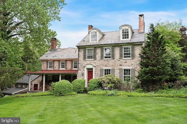 2320 Turk Rd, Doylestown, PA 18901 - back of house featuring a high end roof, a yard, a chimney, and stone siding