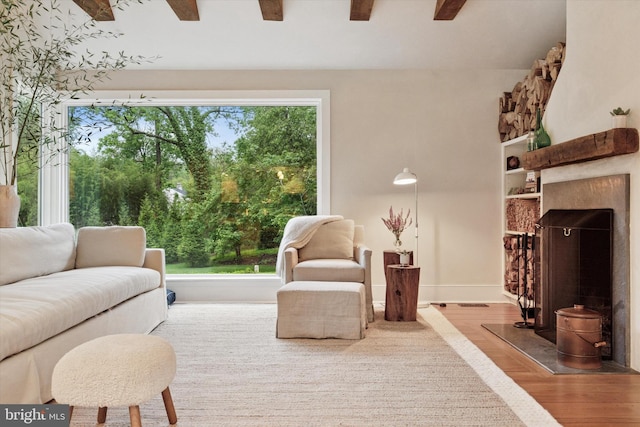 2320 Turk Rd, Doylestown, PA 18901 - living area with wood finished floors, a ceiling fan, baseboards, and a high end fireplace