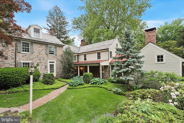 2320 Turk Rd, Doylestown, PA 18901 - view of front facade featuring stone siding, a chimney, a front lawn, and a high end roof