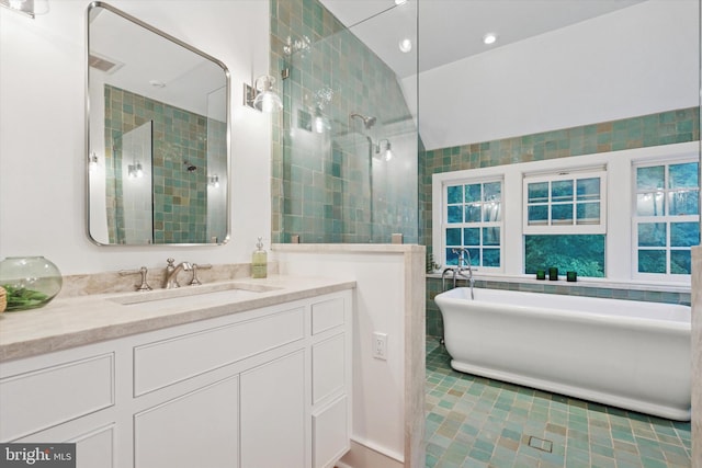 2320 Turk Rd, Doylestown, PA 18901 - bathroom with vanity, a soaking tub, tile walls, a tile shower, and tile patterned flooring