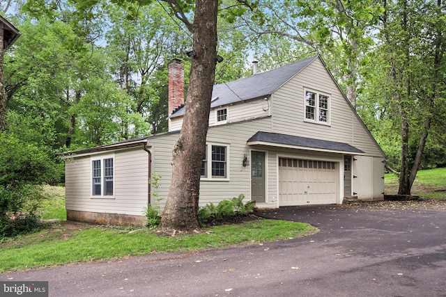 2320 Turk Rd, Doylestown, PA 18901 - view of front of house with a chimney, driveway, and roof with shingles