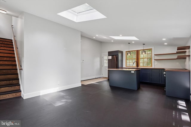 2320 Turk Rd, Doylestown, PA 18901 - kitchen featuring recessed lighting, a skylight, freestanding refrigerator, a center island, and lofted ceiling