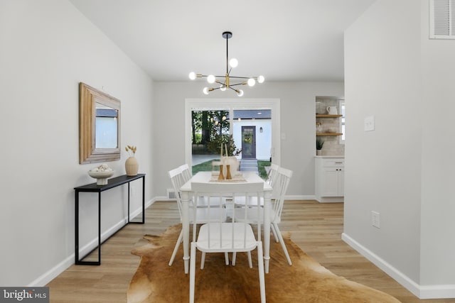 13803 Lionel Ln, Rockville, MD 20853 - dining area with a chandelier, light wood-type flooring, and baseboards