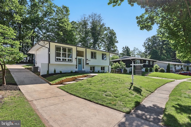 13803 Lionel Ln, Rockville, MD 20853 - bi-level home featuring brick siding, a front lawn, and central AC