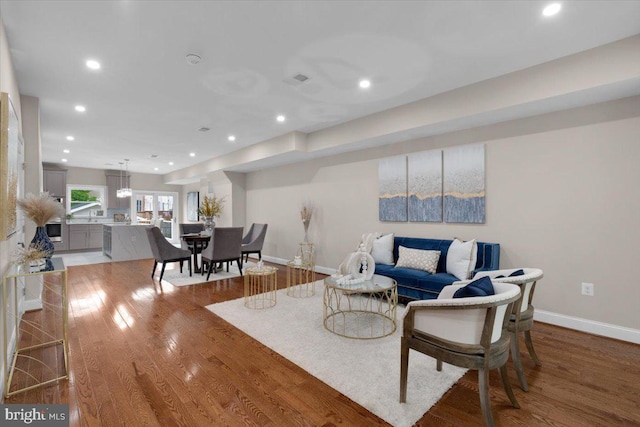 5521 4th St NW, Washington, DC 20011 - living area with light wood-style flooring, baseboards, and recessed lighting
