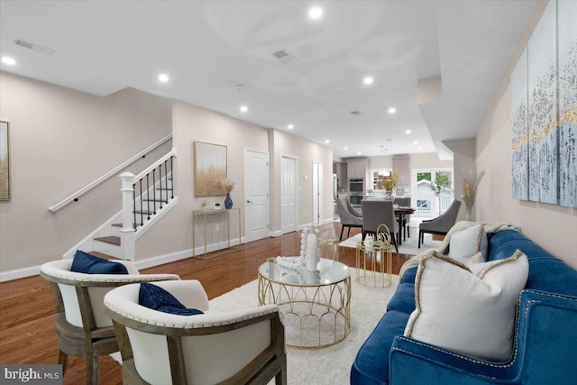 5521 4th St NW, Washington, DC 20011 - living area featuring wood finished floors, stairway, recessed lighting, and baseboards