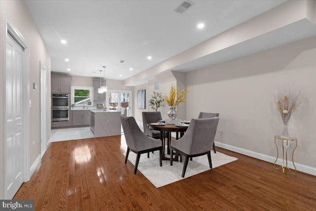 5521 4th St NW, Washington, DC 20011 - dining room featuring light wood-style flooring, recessed lighting, and baseboards
