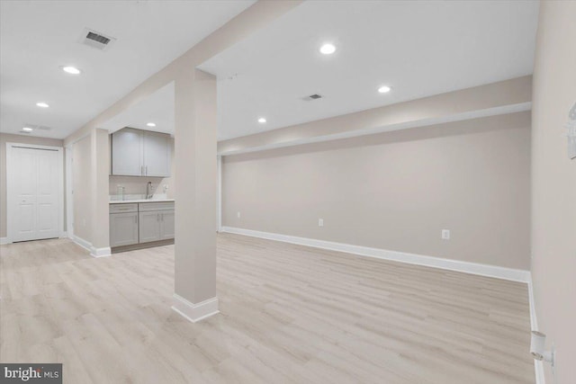 5521 4th St NW, Washington, DC 20011 - finished below grade area featuring baseboards, light wood finished floors, recessed lighting, and a sink