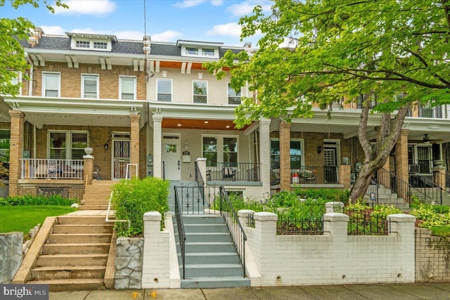 5521 4th St NW, Washington, DC 20011 - multi unit property featuring mansard roof, stairs, brick siding, a porch, and roof with shingles