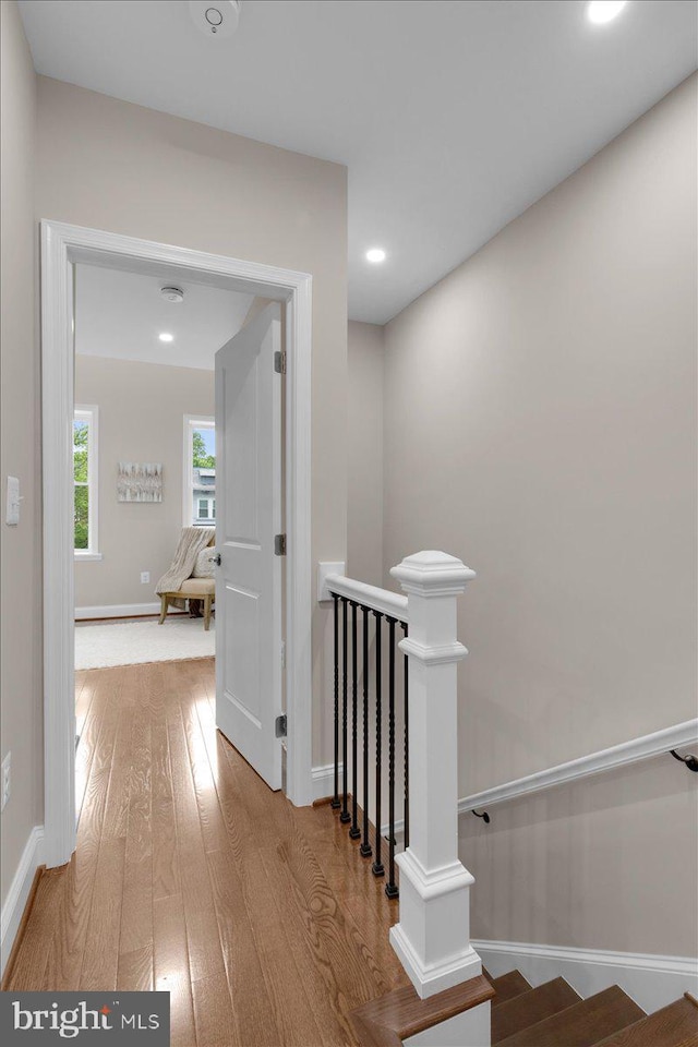 5521 4th St NW, Washington, DC 20011 - hall with wood-type flooring, an upstairs landing, baseboards, and recessed lighting