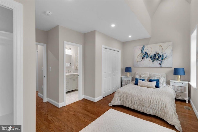 5521 4th St NW, Washington, DC 20011 - bedroom with wood finished floors, a sink, baseboards, a closet, and recessed lighting