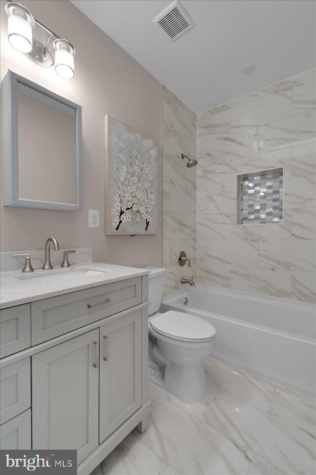 5521 4th St NW, Washington, DC 20011 - full bathroom with vanity, toilet, shower / bath combination, and marble look tile flooring